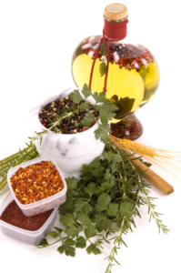 Samling av urter, krydder og flaske med olje med krydder i